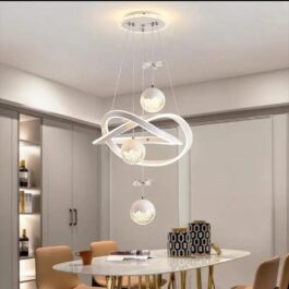 Bright energy-efficient LED infinity light fixture illuminating a stylish home dining area.