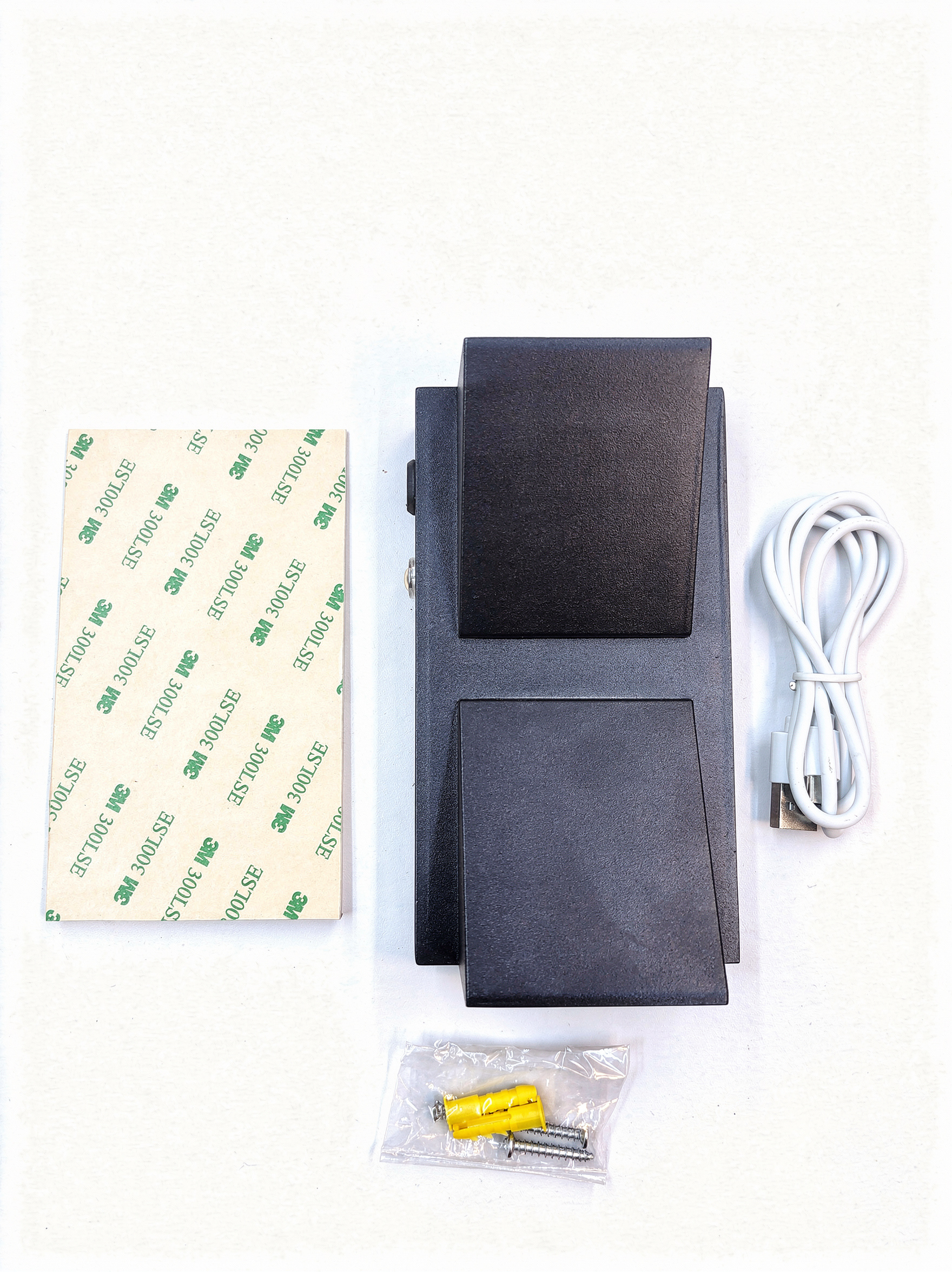 Wireless rechargeable wall sconce unboxing kit with 3M adhesive and USB-C cable.