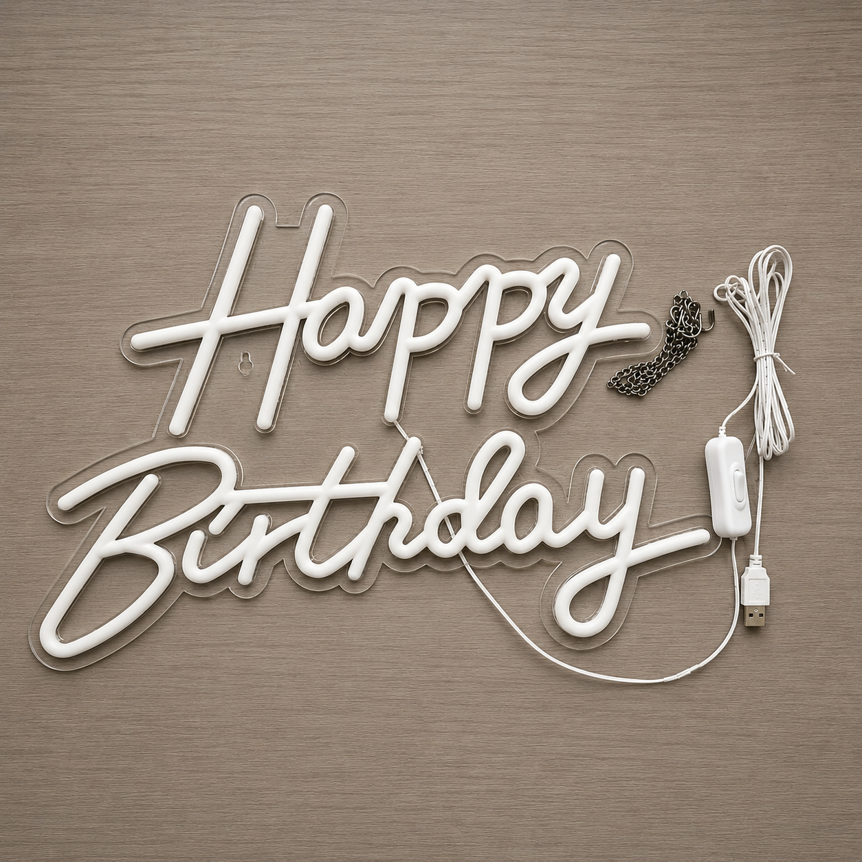 Happy Birthday LED neon sign kit showing clear acrylic backing, white tubing, USB power cord with on-off switch, and silver hanging chain.